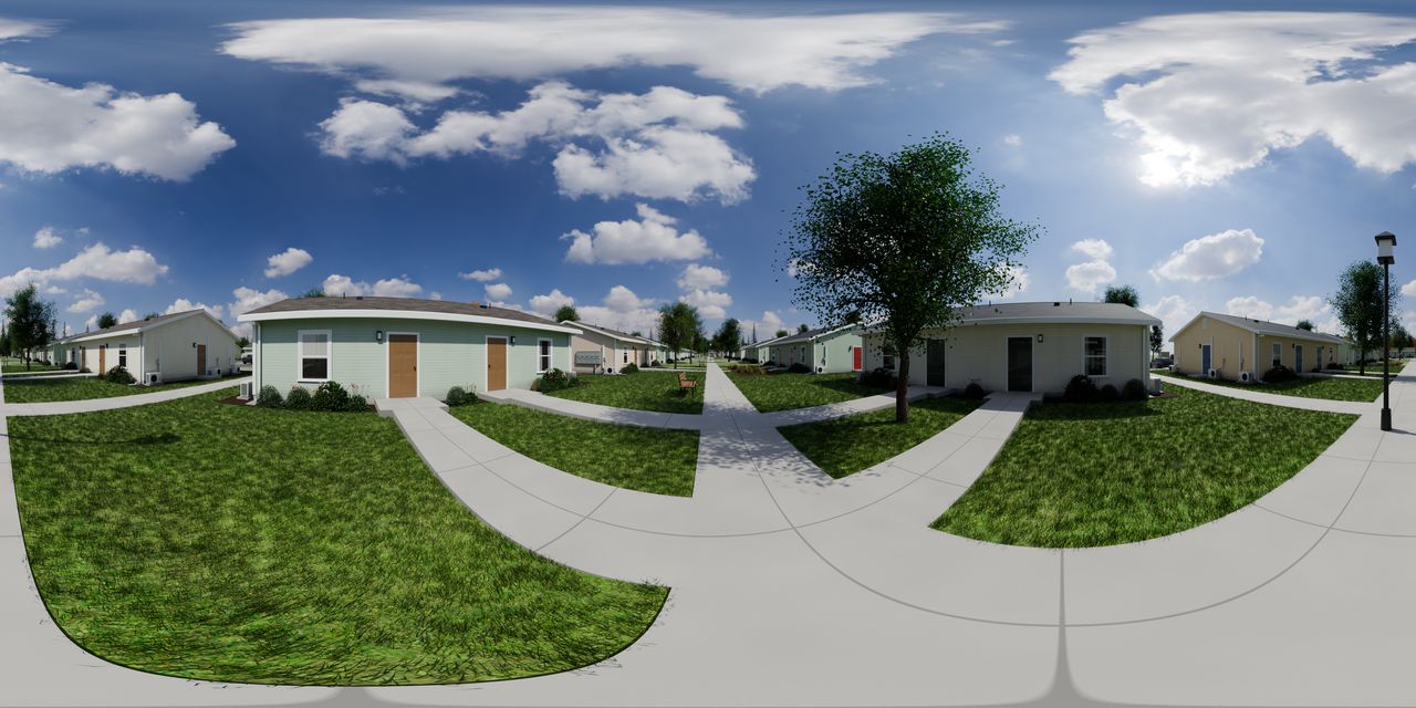 A lawn crossed by walks, with one-story homes facing it on each side, a tree, a bench and a lamp post.